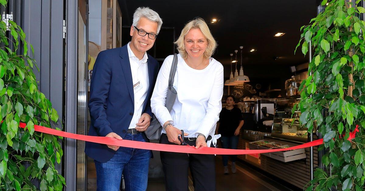 Kathrin and Stefan Tewes cutting the opening ribbon